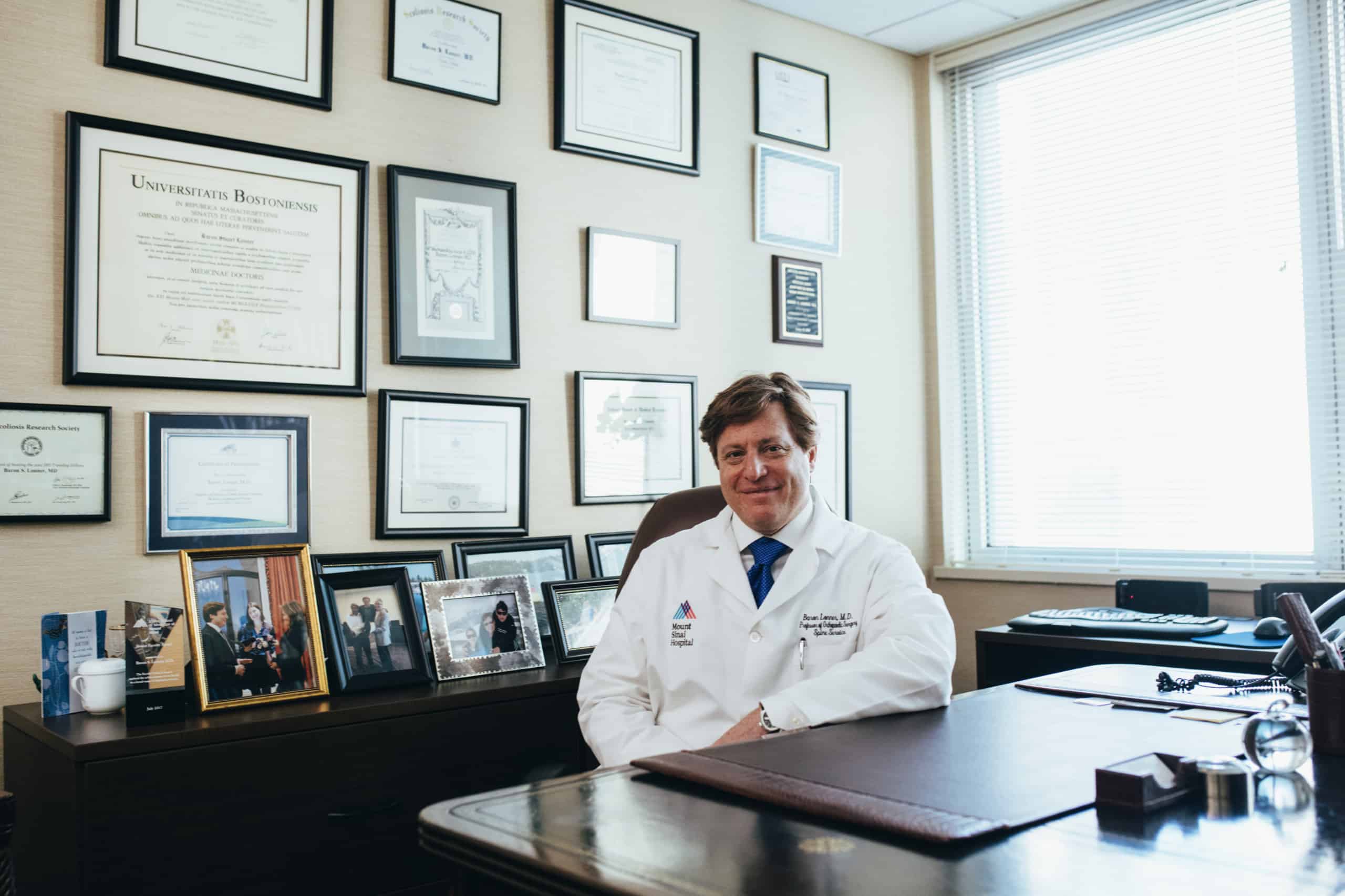 Doctor sitting in front of his desk