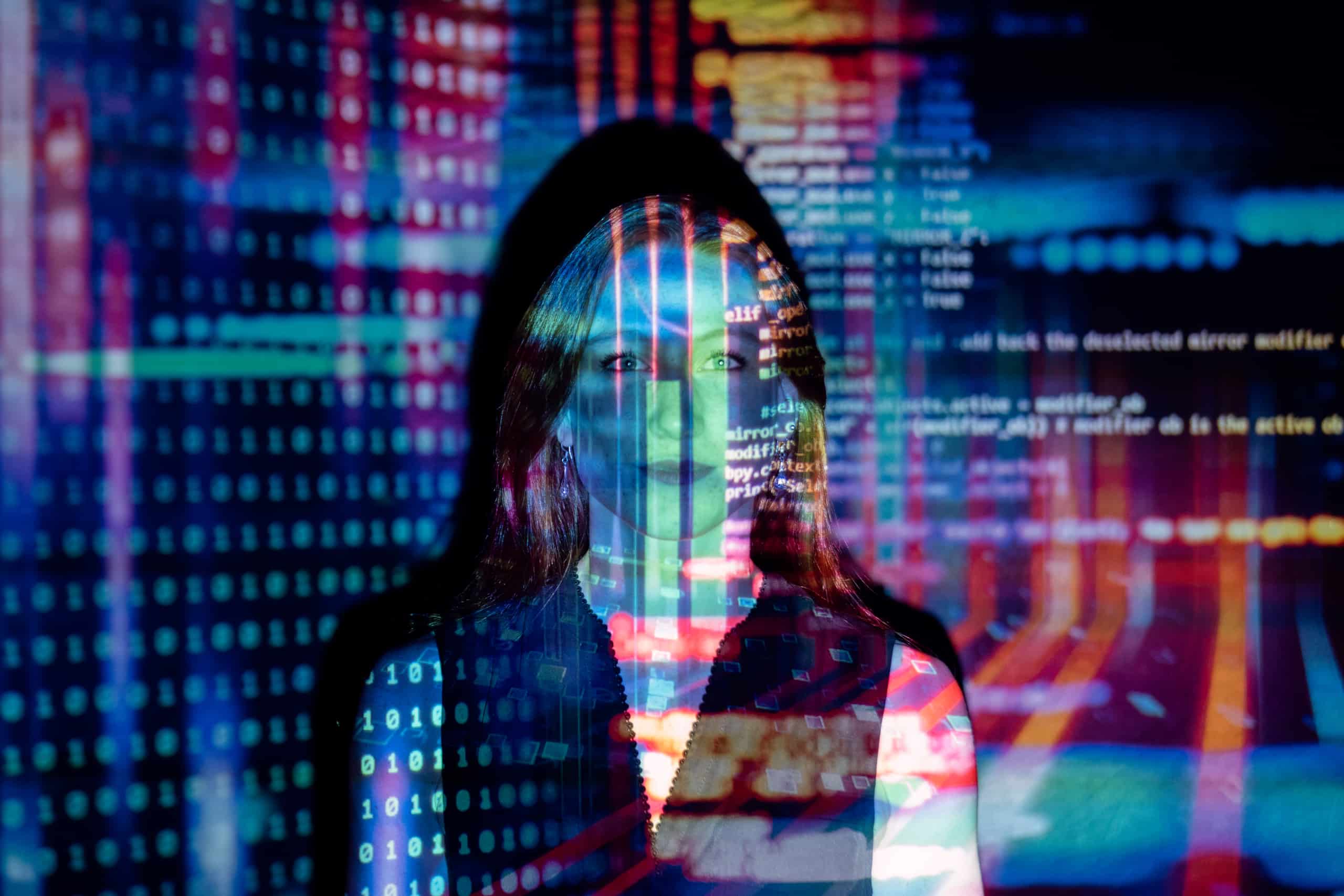 Photo of code projected over woman