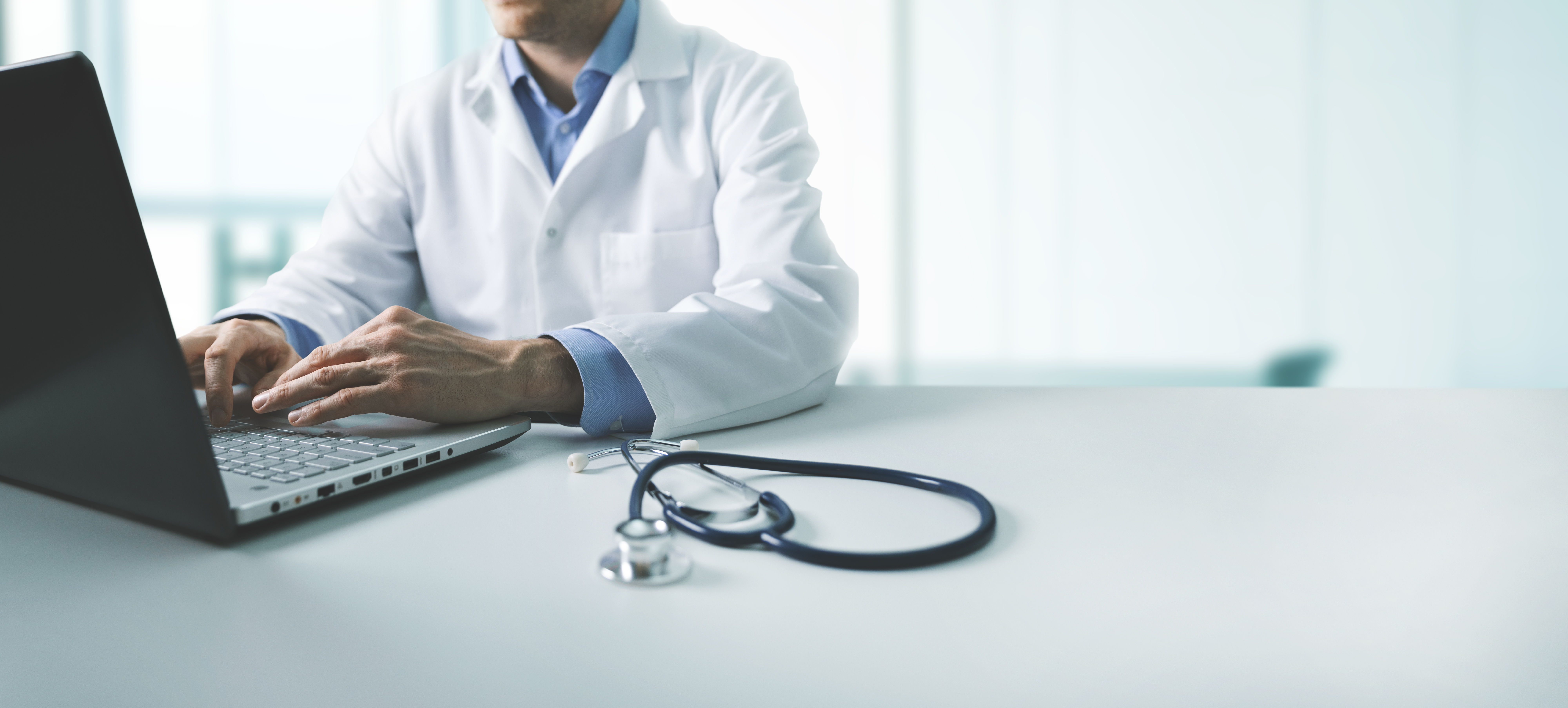 online medical consultation – doctor working on laptop computer